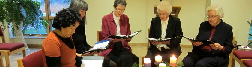 Sisters and sojourners gathered around the Advent wreath for evening prayer