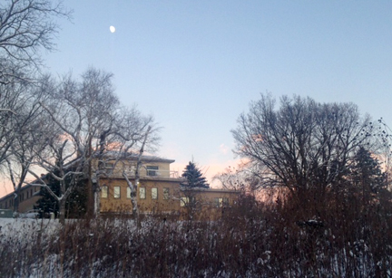 glow of sunset and a full moon over the retreat and guest house